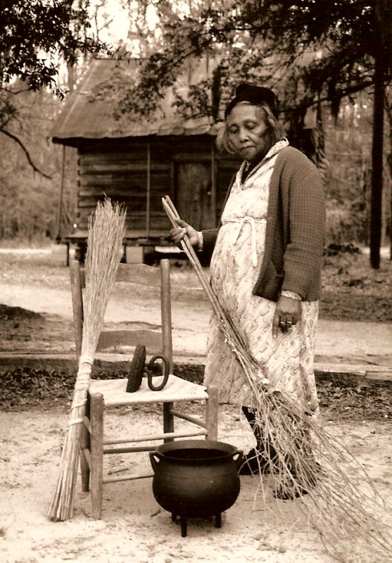 Ms.
              Catherine with yard broom