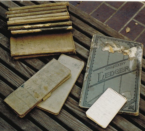 Small spiral notebook and ledgers