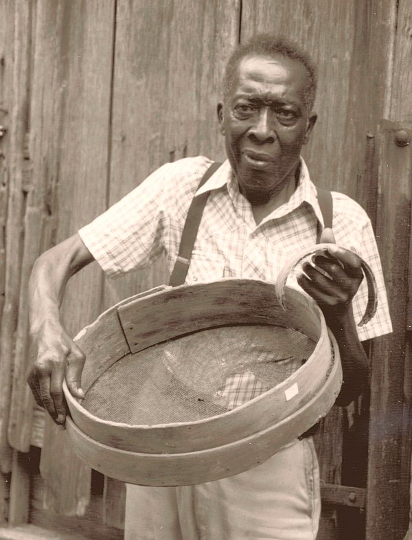 Man
              holding sifter