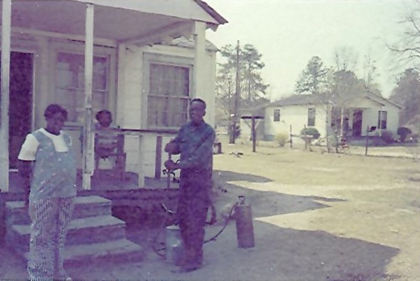 Waiterses in
              front of their home in the 1950s